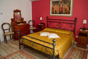 Postel nebo postele na pokoji v ubytování B&B La Rinascita
