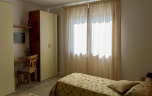 Postel nebo postele na pokoji v ubytování B&B La Rinascita