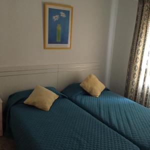 Postel nebo postele na pokoji v ubytování Casa Reyes Fataga
