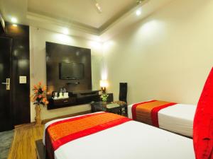 Cama o camas de una habitación en Hotel Elegance