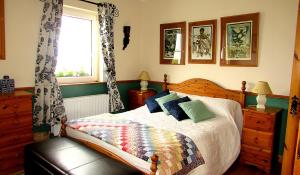 A bed or beds in a room at Breacan Cottage B&B