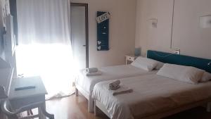 Postel nebo postele na pokoji v ubytování Hotel Marbel