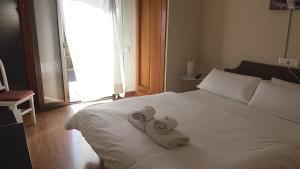 Postel nebo postele na pokoji v ubytování Hotel Marbel