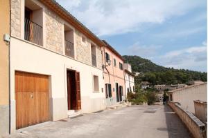an empty street in a town with buildings at Casa Bella Mirada in Caimari