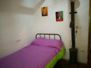 Кровать или кровати в номере Alojamiento rural El Batán