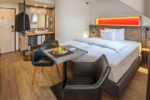 Voodi või voodid majutusasutuse Boutiquehotel Thessoni Classic & Self service Residence Home Zürich toas