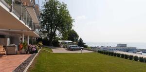 a car parked on a lawn next to a building at Villa Friede_Marie_ App_ Meere in Sassnitz