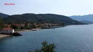a view of a body of water with mountains at Notus Villa in Chorto