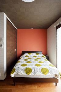 Ein Bett oder Betten in einem Zimmer der Unterkunft Miyabi