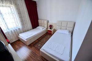 Rúm í herbergi á Hotel Argenti