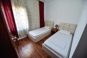 Rúm í herbergi á Hotel Argenti