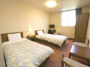 Cama o camas de una habitación en Hotel Hisashi