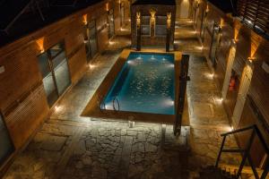 an overhead view of a swimming pool at night at Hotel Manada del Desierto in San Pedro de Atacama