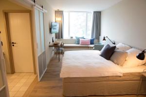 Postel nebo postele na pokoji v ubytování Hotel Strandleben