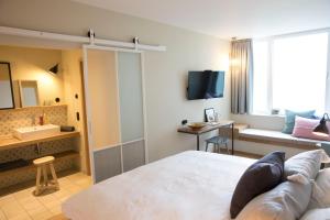 TV a/nebo společenská místnost v ubytování Hotel Strandleben