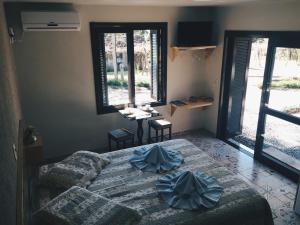 Cama ou camas em um quarto em Espaço Holístico Chalés