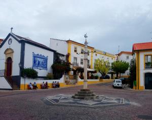 a street with a clock in the middle of a town at Casa Sardoal in Sardoal