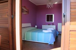 Кровать или кровати в номере Villetta Airone