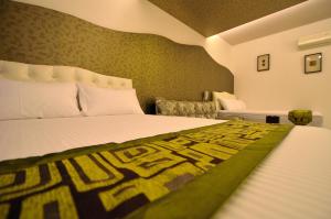 Postel nebo postele na pokoji v ubytování Easy Home Stay