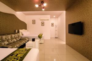 TV a/nebo společenská místnost v ubytování Easy Home Stay