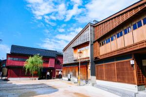 a group of buildings on a city street at Kanazawa Hakuchoro Hotel Sanraku -Natural Hot Spring- in Kanazawa