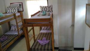 Postel nebo postele na pokoji v ubytování Sealor Pension House