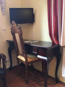 TV a/nebo společenská místnost v ubytování Fachwerk-Hotel Eisenbart