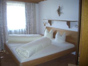 Ένα ή περισσότερα κρεβάτια σε δωμάτιο στο Aparthotel Garni am Johannesbrunnen