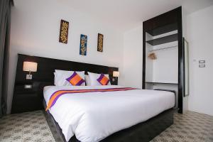 Кровать или кровати в номере SakSukSmile Resort