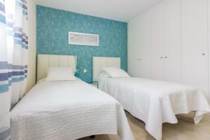 Кровать или кровати в номере Magnolia Duplex