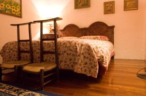 En eller flere senge i et værelse på Villa Bertagnolli - Locanda Del Bel Sorriso