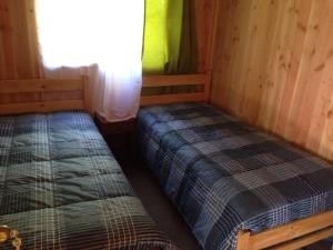 Postel nebo postele na pokoji v ubytování Cabañas El Boldo