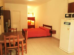 Postel nebo postele na pokoji v ubytování Departamentos Flor de Loto