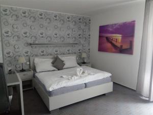 Posteľ alebo postele v izbe v ubytovaní Penzion KASPEC