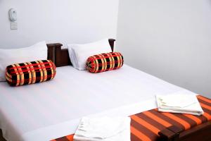Postel nebo postele na pokoji v ubytování Vishmee Holiday Inn + 37 fotografií