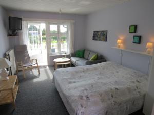 Letto o letti in una camera di Motel Garni Blåvand