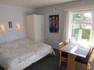 Letto o letti in una camera di Motel Garni Blåvand