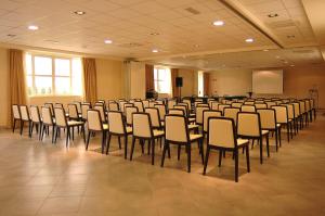 a large room with chairs and a podium in it at L'Angolo in Carisio