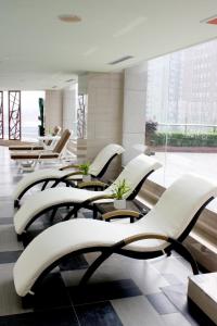 a row of chairs and tables in a building at Baolong Hotel Shanghai in Shanghai