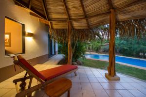 The swimming pool at or near Tamarindo Dreams Villas with private pool