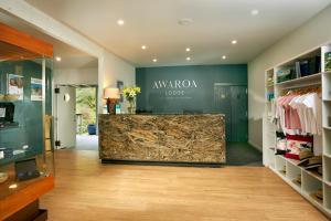 a shop with a marble counter in a room at Awaroa Lodge in Awa-iti