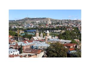 an aerial view of a city with buildings at Bethlehem Terrace in Tbilisi City