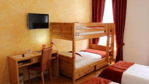 Posteľ alebo postele v izbe v ubytovaní Hostellerie du XVI Siècle