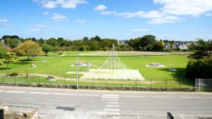 a park with a monument in the middle of a field at Hotel-Restaurant Lann Roz / Côte Cuisine in Carnac