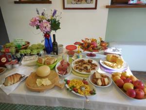 a table topped with lots of different types of food at Agriturismo La Caputa in Urbania