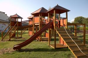 a playground with a slide in the grass at Hapimag Resort Scerne di Pineto in Scerne