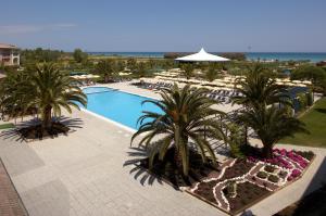 an overhead view of a resort with a pool and palm trees at Hapimag Resort Scerne di Pineto in Scerne