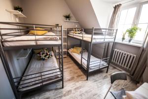Za Murami Hostel客房内的一张或多张床位