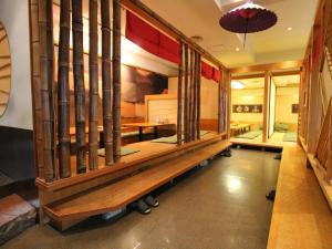 Postel nebo postele na pokoji v ubytování Shibuya Creston Hotel