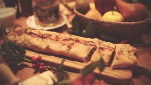 two slices of pizza sitting on top of a table at B&B Villa Ca'Praja in Daone +32 photos